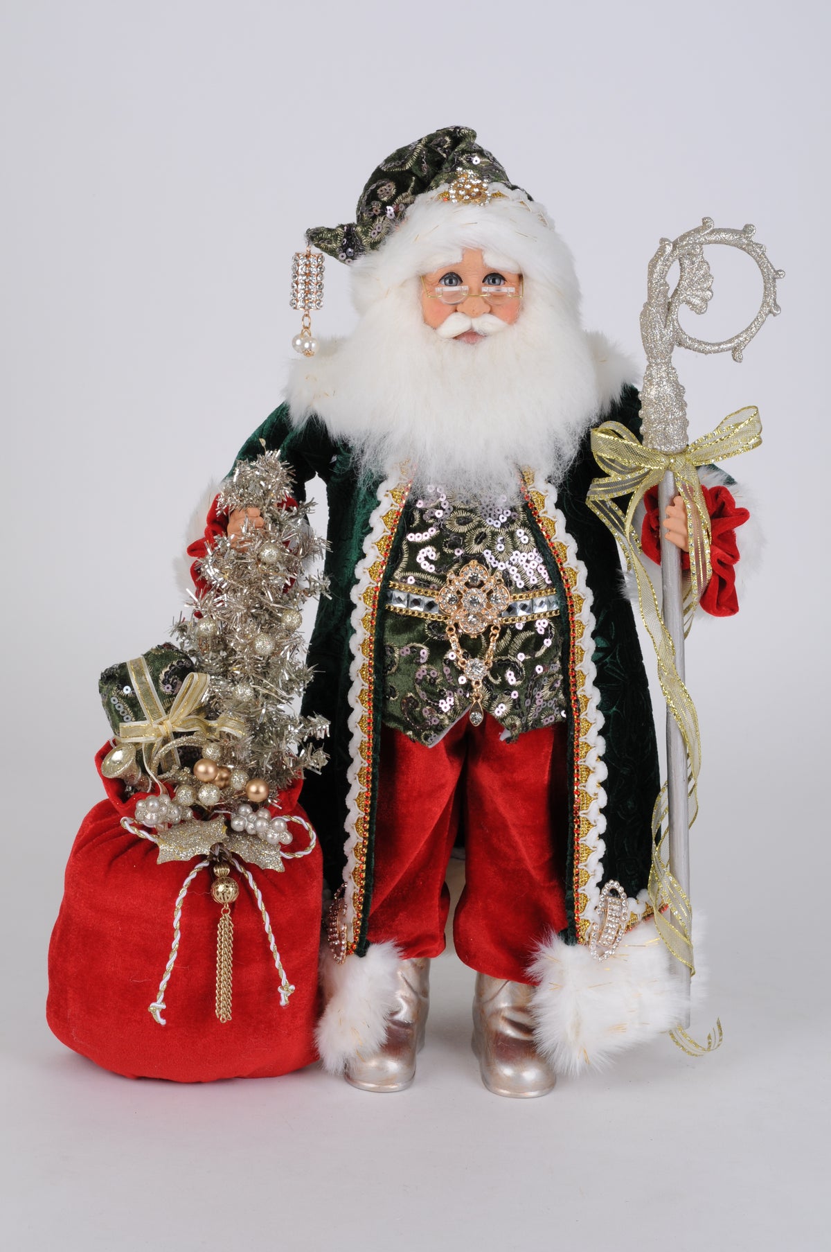 Santa figurine in a sparkling emerald suit with an LED glow.