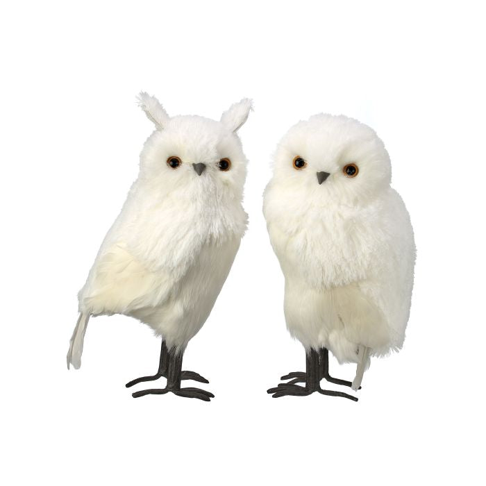 White owl figurine in a perched pose.