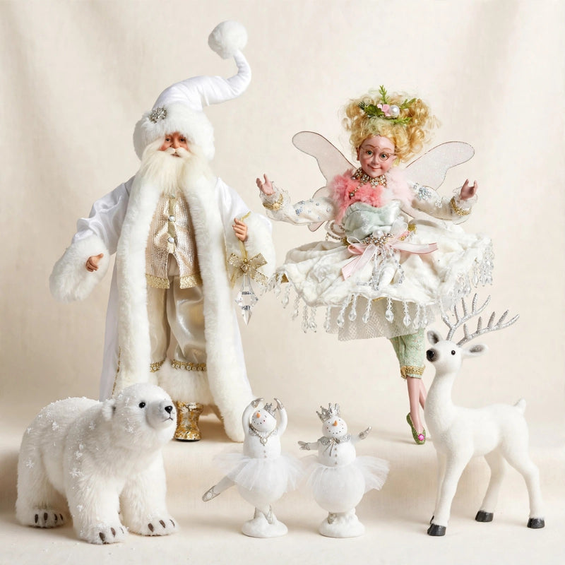 Winter-white grouping: all-white glistening Santa and ivory pastel fairy behind, polar bear and frosty white deer flanking two crowned snowgirl ballerinas in front on warm cream