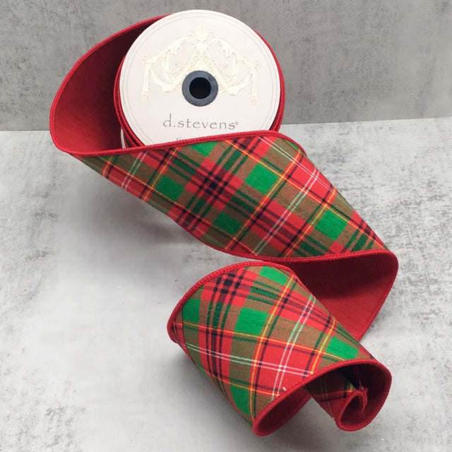 Red ribbon with red and green tartan plaid running on the diagonal.