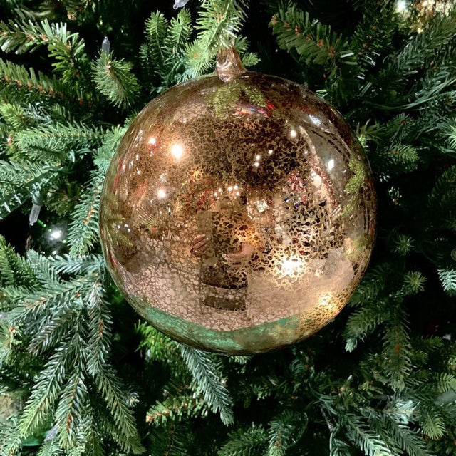 Gold vintage mercury glass ball ornament.