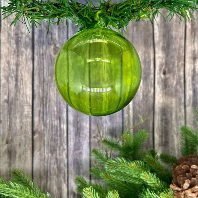 Green and clear glass ball ornament.