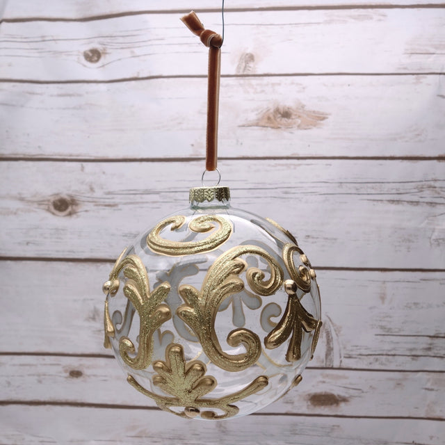 Gold leaf filigree glass ball ornament with a scrolled pattern, 120mm.