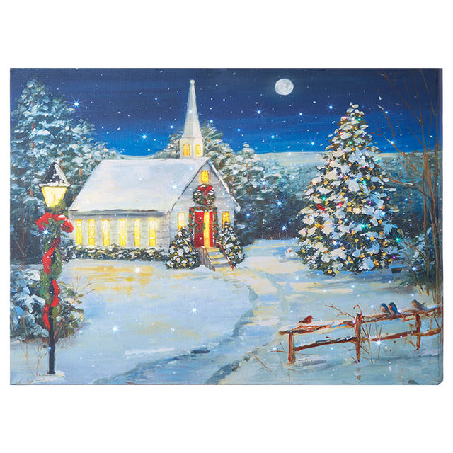 Lighted church print village piece with a warm glow.
