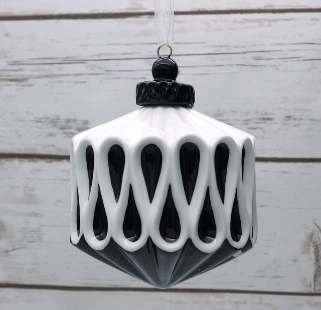 Black and white glass ornament with a graphic finish.
