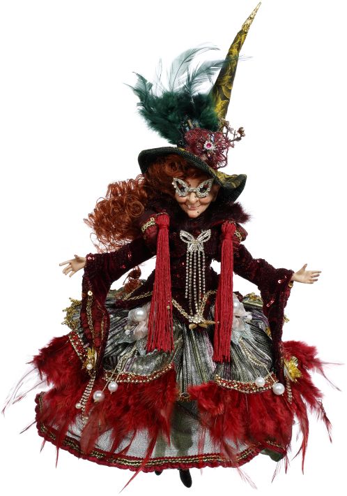 Towering witch figurine in a layered Halloween costume.