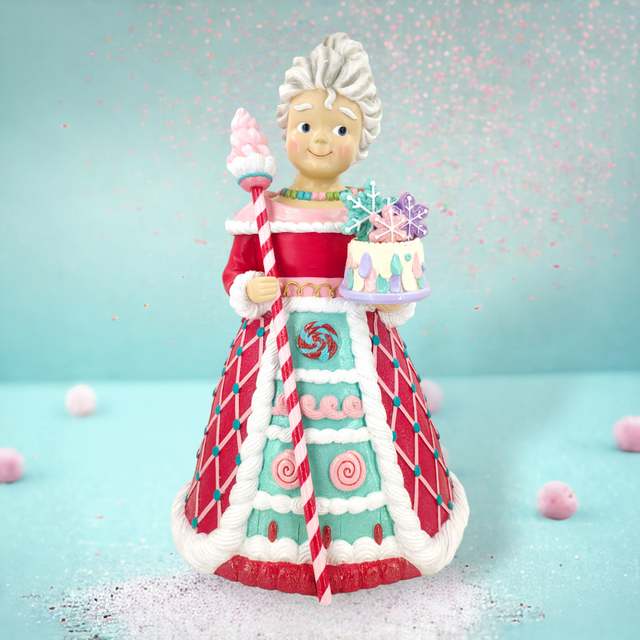Sweet Shoppe Mrs. Claus figurine holding a staff, with candy details.
