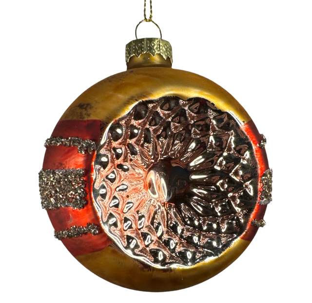 Red reflector glass ornament with a vintage indent.