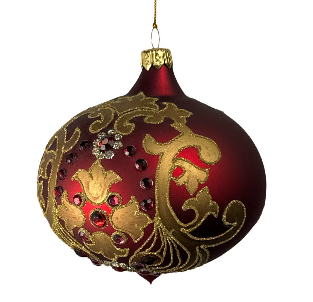 Vintage glass onion ornament with gold scrollwork.