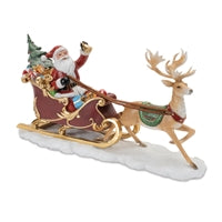 Resin Santa sleigh and deer figurine.