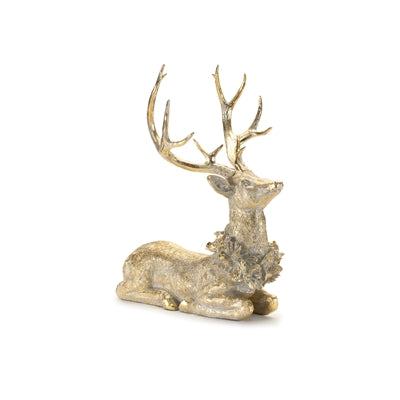 Gold resin deer figurine reclining with a wreath collar.
