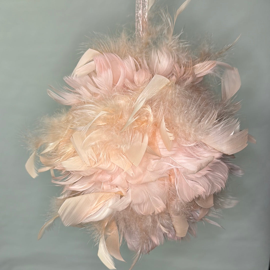 Pink ornament with pink feather detail.