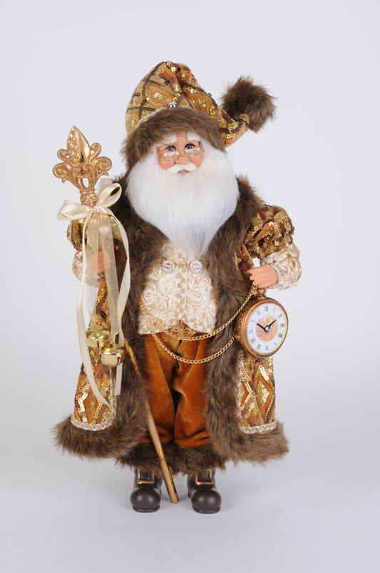 Gold and brown Santa figurine holding a fleur-de-lis staff and pocket watch.