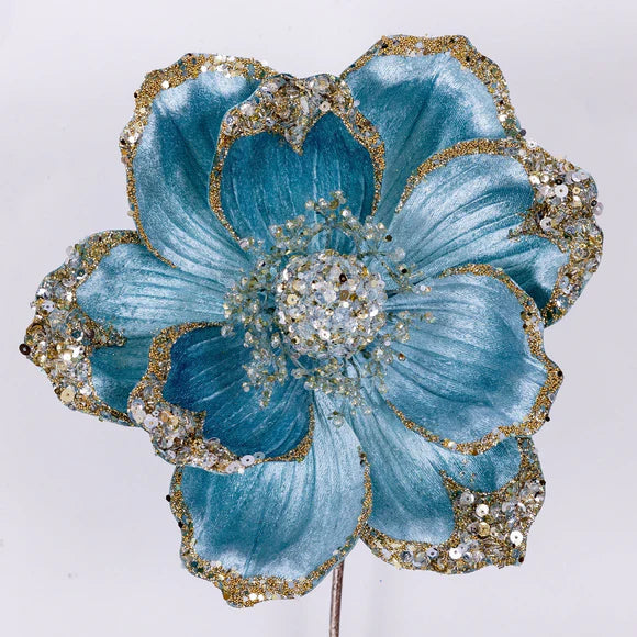 Light blue Victorian magnolia stem with a full layered bloom.