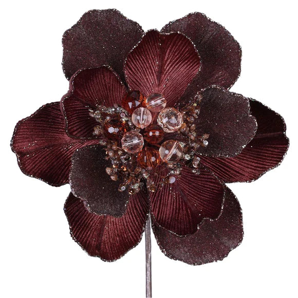 Chocolate grand magnolia stem with large brown petals.