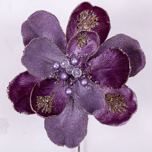 Lavender magnolia stem with a layered bloom.