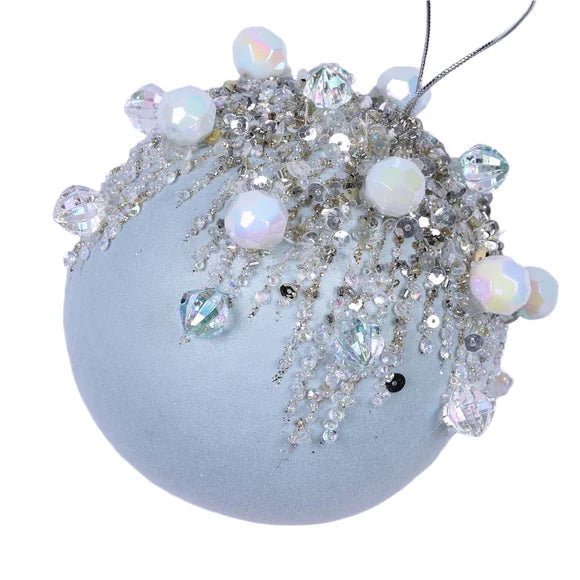 Light blue magical ornament with a bejeweled finish.