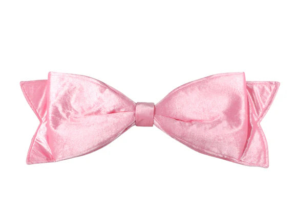 Pink velvet bow with large structured loops.