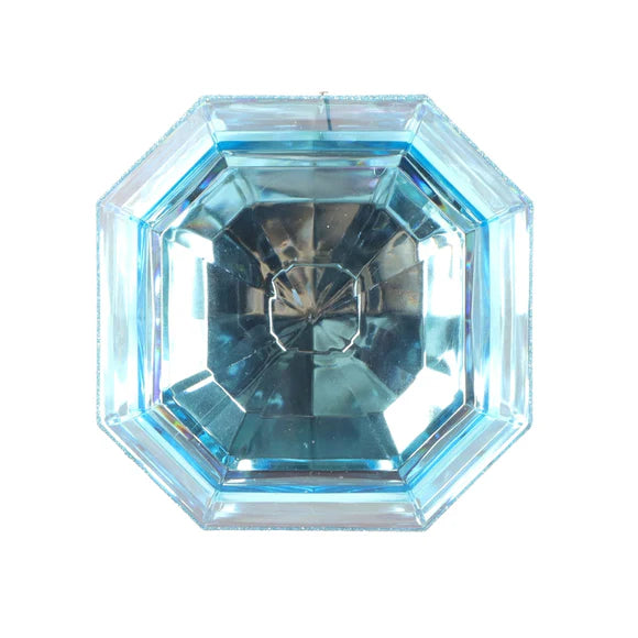 Light blue ornament with light blue gem detail.