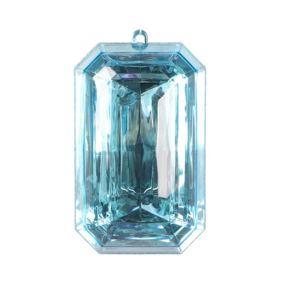 Light blue figurine with light blue gem detail.