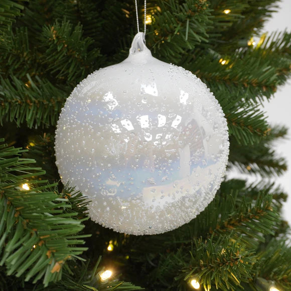 White ball ornament with white winter rainbow detail.