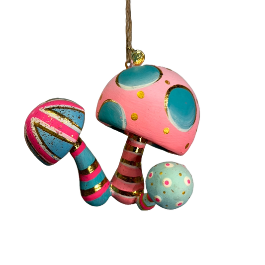 Pink and blue mushroom ornament with a woodland form.