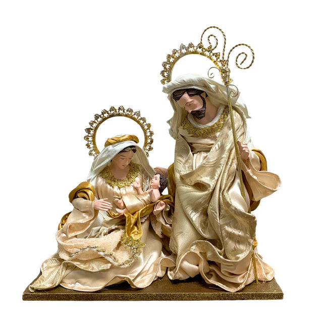 Holy Family nativity figure in ivory robes with gold trim and wire halos.