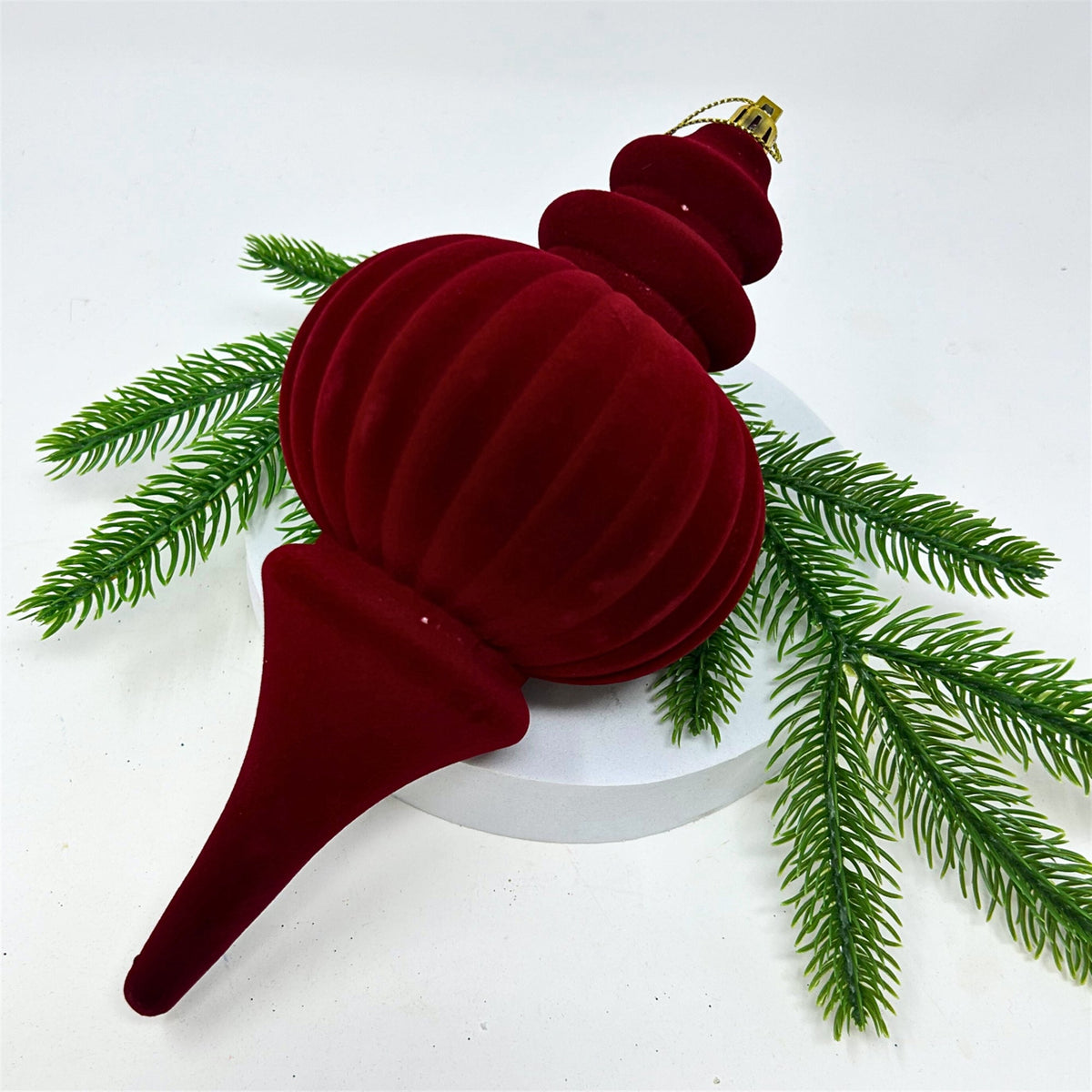 Crimson flocked finial ornament with a soft finish.