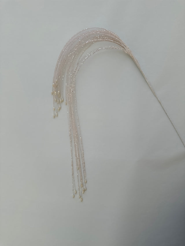 Light pink hanging spray with trailing stems.