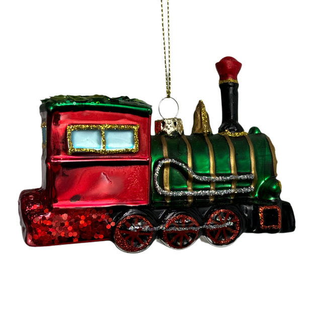 Red green glass village piece with glass train red green detail.
