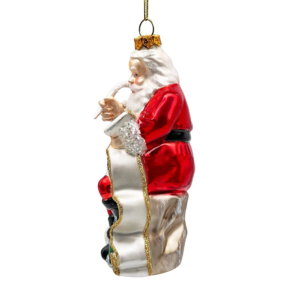 Red glass Santa ornament, side view unrolling his long white Christmas list.