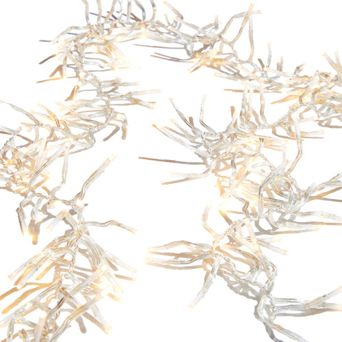 Warm white cluster light garland on clear wire.