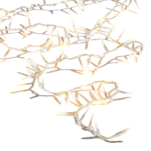 Warm white snake lights on clear wire with a remote, draped as a garland.