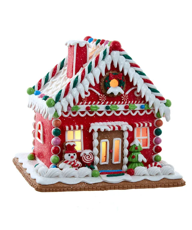 Red gingerbread house village piece with a bulb form.