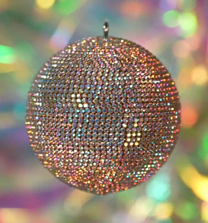 Iridescent rhinestone ornament medallion with a crystal paved surface.