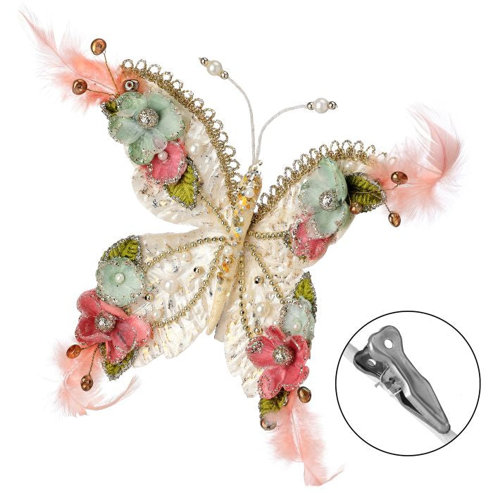 Floral butterfly clip ornament with pearl and glitter detail.