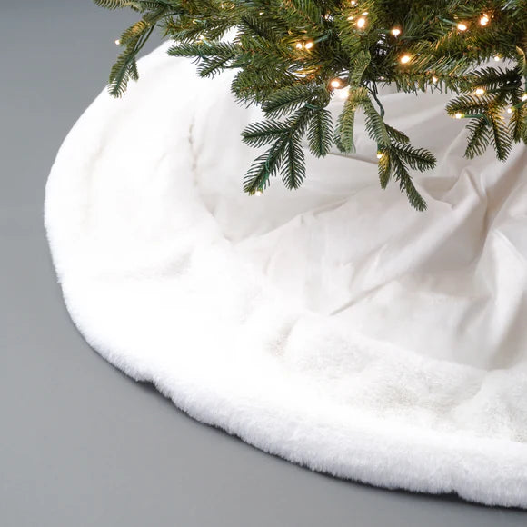 White Santa tree skirt with a festive Santa design.