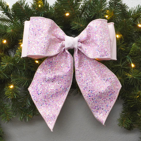 Light pink confetti glitter bow with long flowing tails.