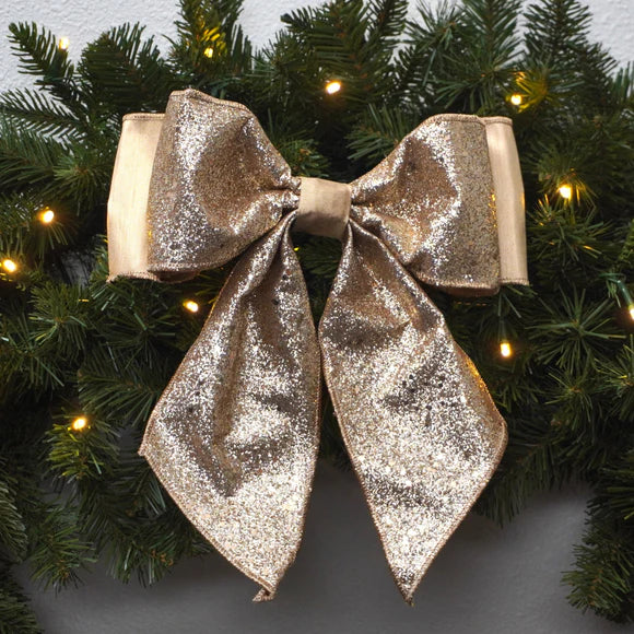 Champagne bow with confetti glitter flecks.