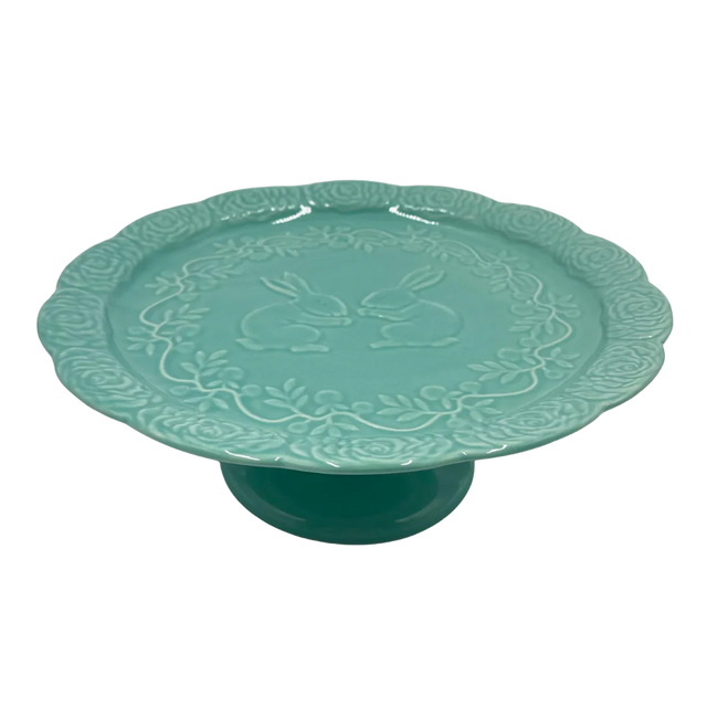 Turquoise ceramic stand with a bold finish.