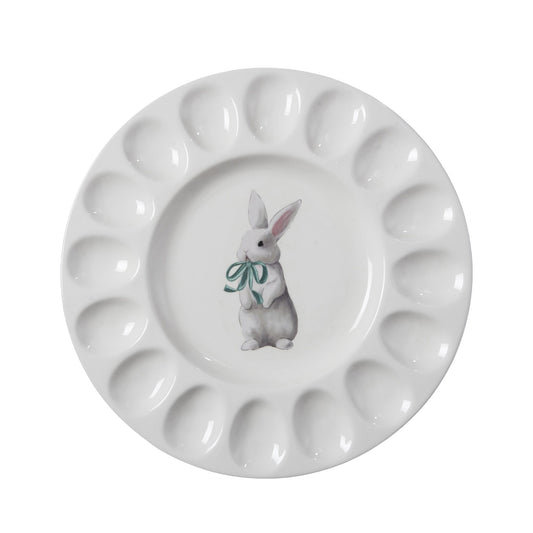 White egg serving plate with a bunny illustration.