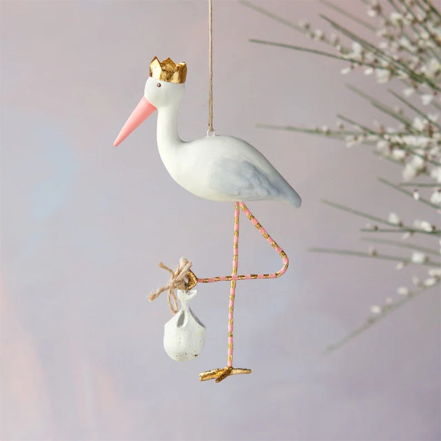 Pink royal stork ornament with a regal form.