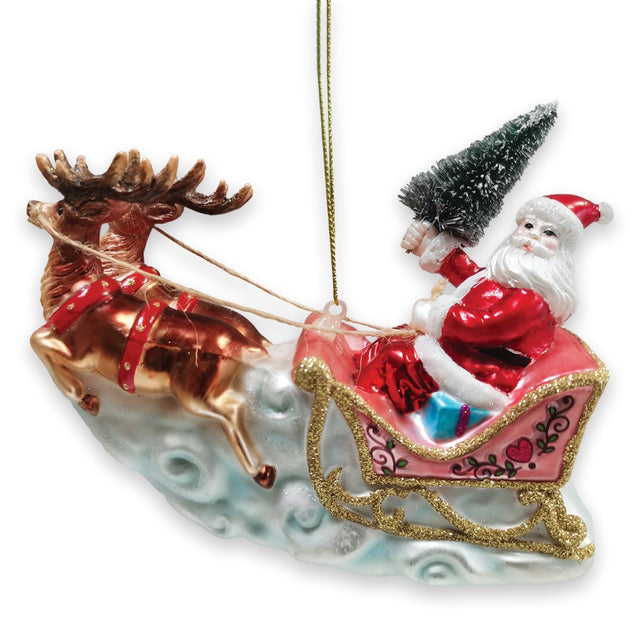 Pink glass sleigh ornament with Santa and a copper reindeer gliding over clouds.