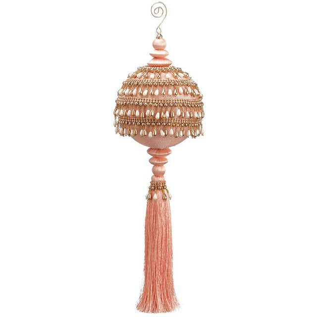Coral pearl tassel ornament with draped strands.