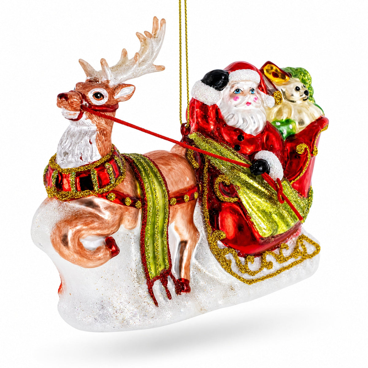 Gold glass sleigh ornament with Santa, a reindeer and a puppy riding over snow.