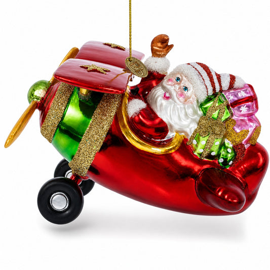 Red glass airplane ornament with Santa waving from the cockpit and gifts aboard.