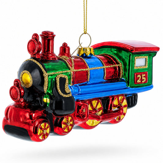Green glass train ornament with a red and blue locomotive and gold trim.
