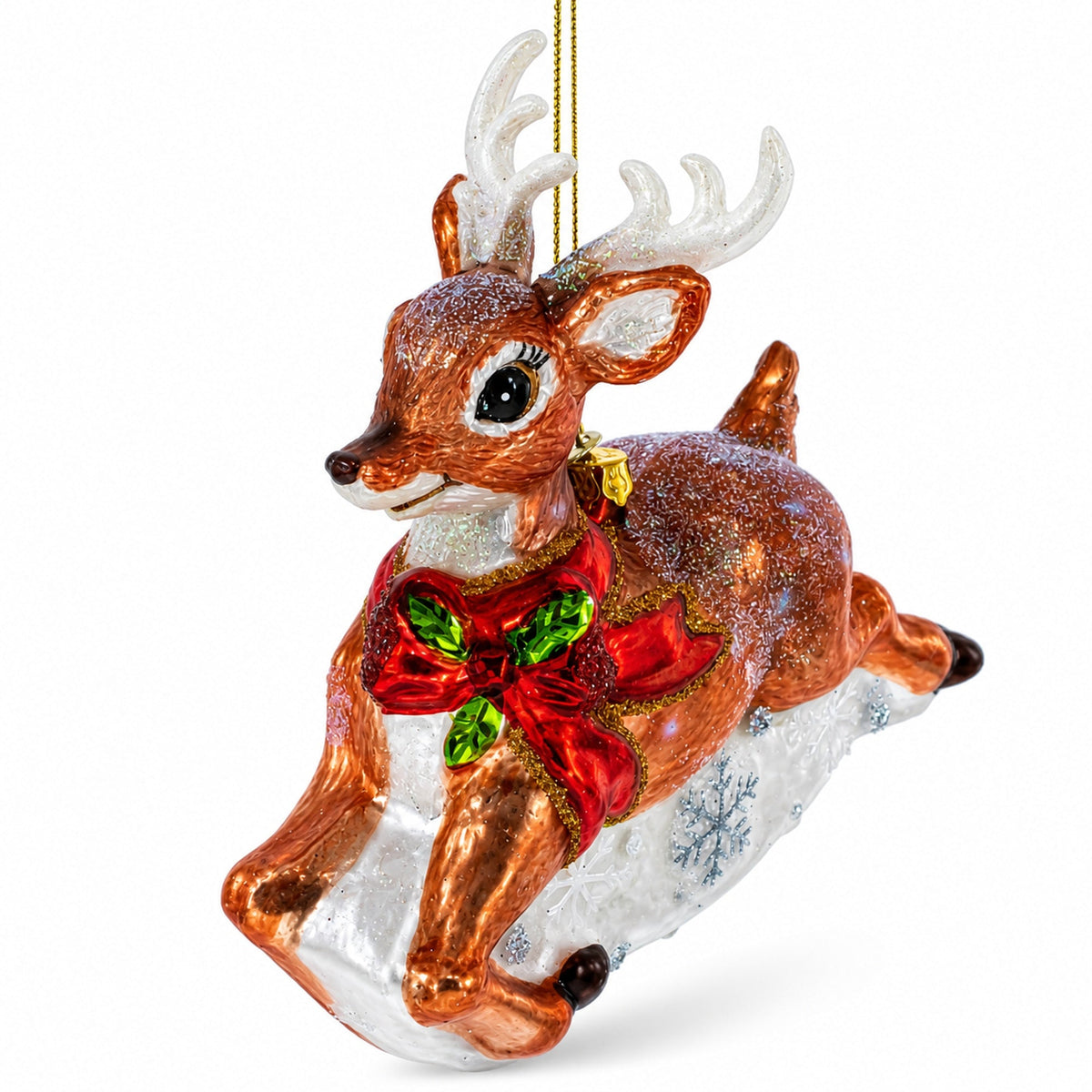 Brown glitter glass reindeer ornament leaping with a red bow and holly.
