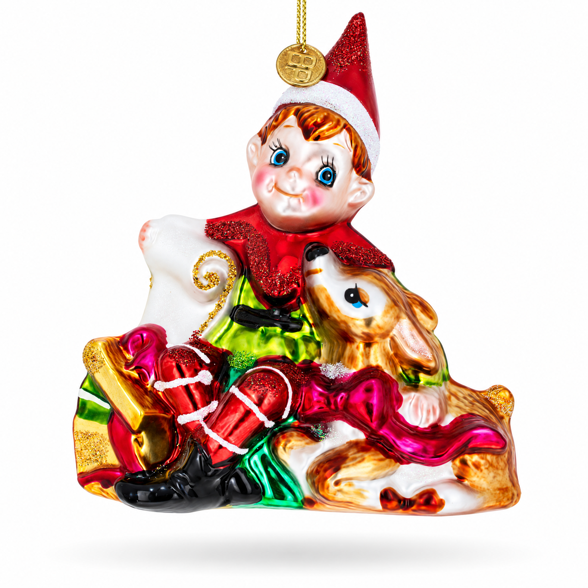 Red glass elf ornament sitting with a fawn and wrapped gifts.