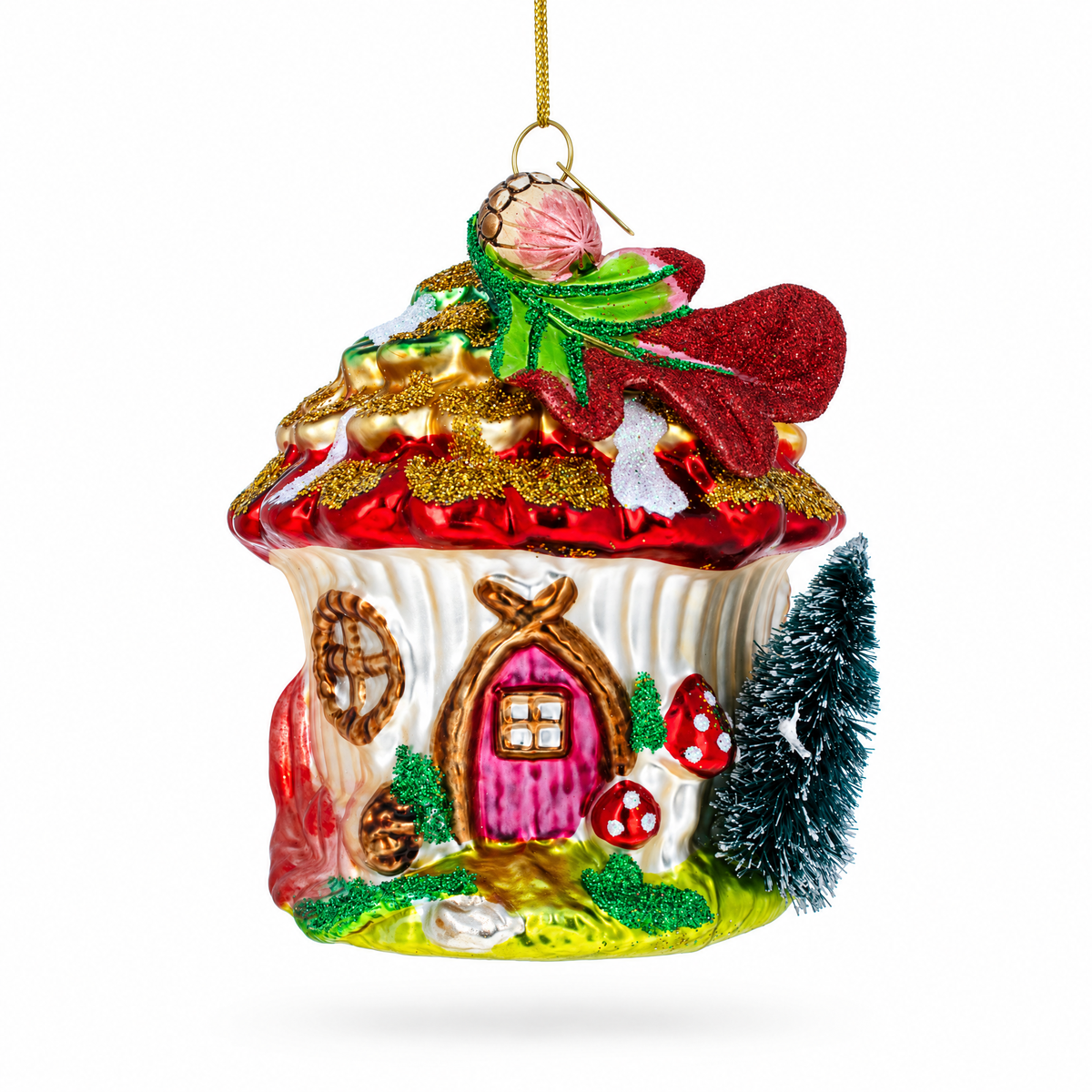 Red glass fairy house ornament with a mushroom roof, pink door and a tiny pine tree.